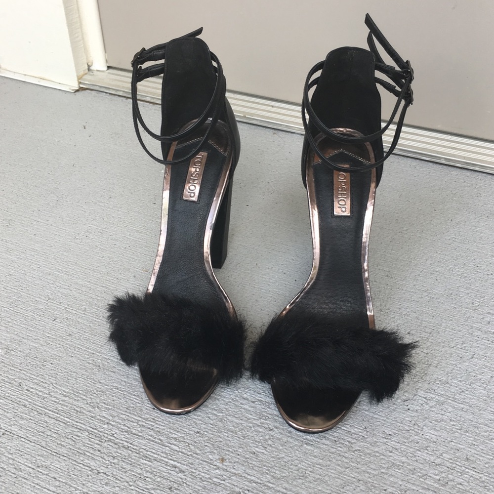 Black heels with fur detail.
